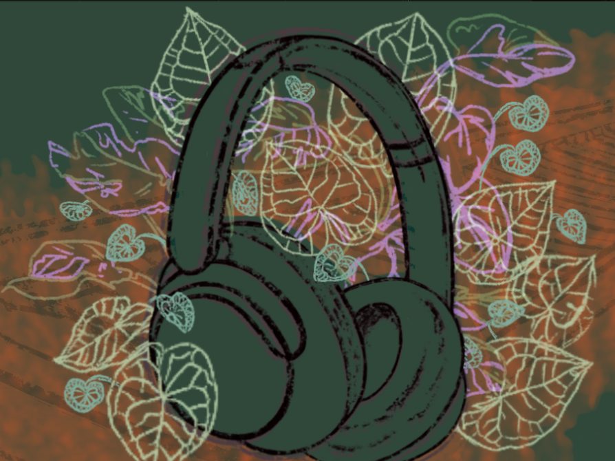 Headphones surrounded by leaves