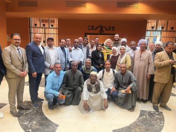 Group photo of team members of the Abydos Middle Cemetery Project stand in the Sohag National Museum.