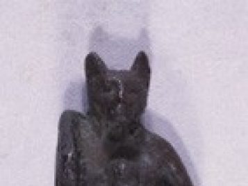 Bronze statuette of Bastet with a cat head.