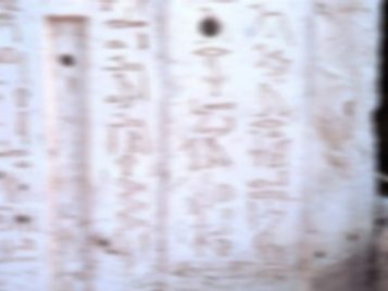 Close-up of a limestone block bearing hieroglyphic inscriptions.