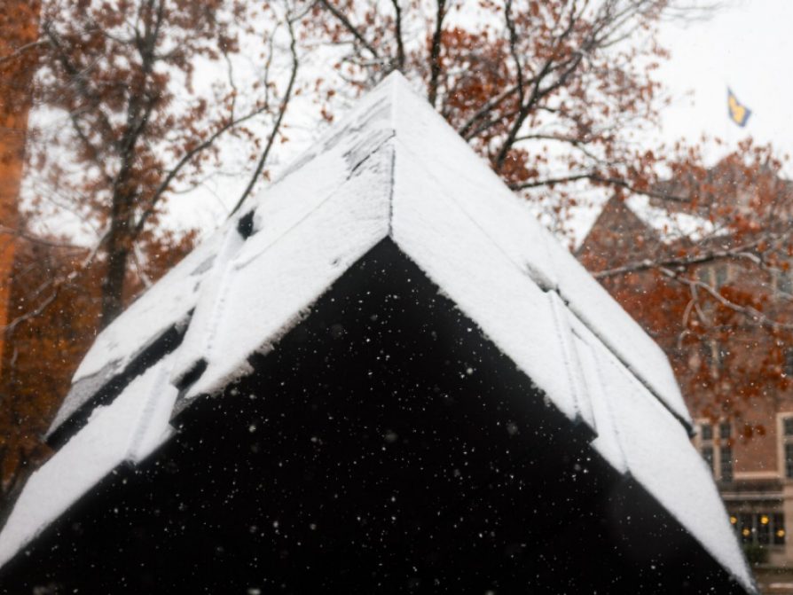 The cube covered in snow in front of the LSA building