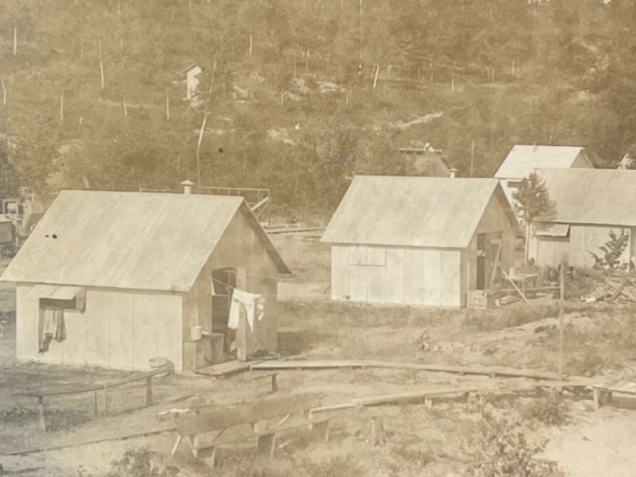 Black and white aerial photo of cabins