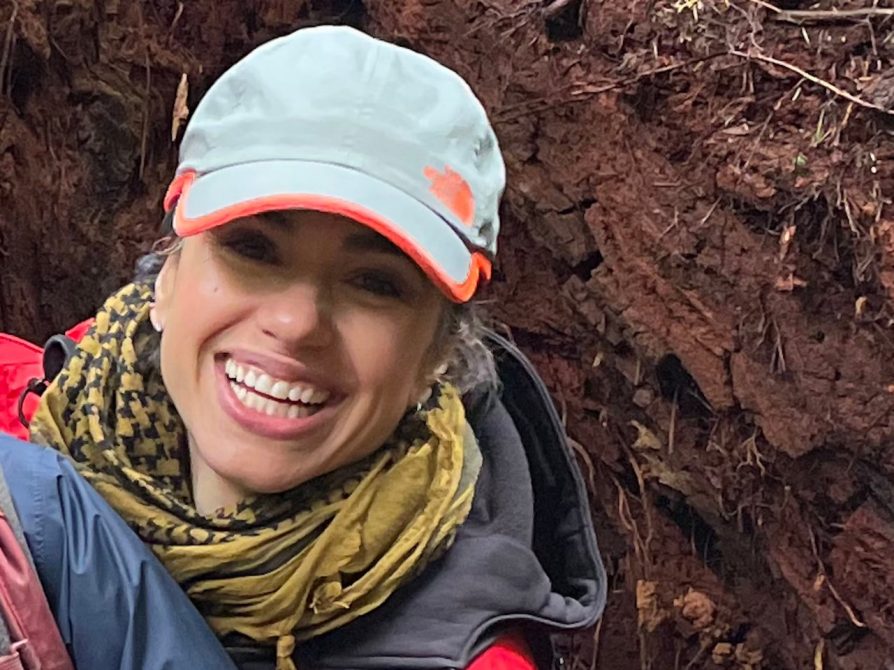 Raven Garvey smiling in a baseball hat