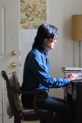 Side profile of Michael Zhai sitting at a computer