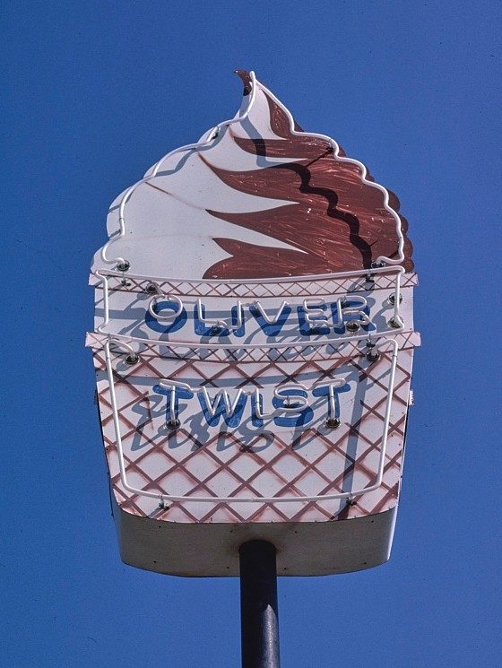 Sign shaped like an ice cream cone with a the words "Oliver Twist"