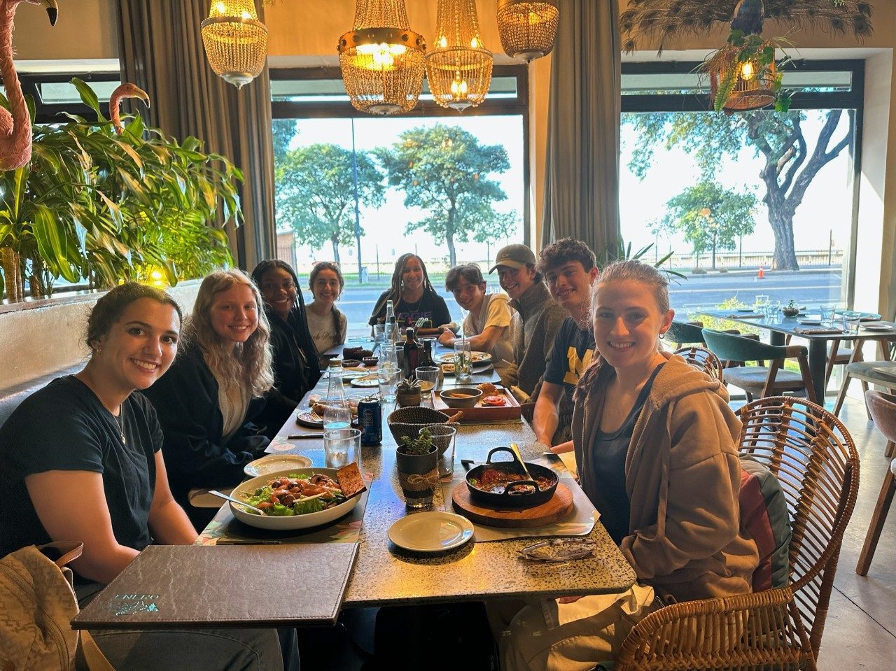 The Buenos Aires cohort sits down to share a meal together at a cozy restaurant.