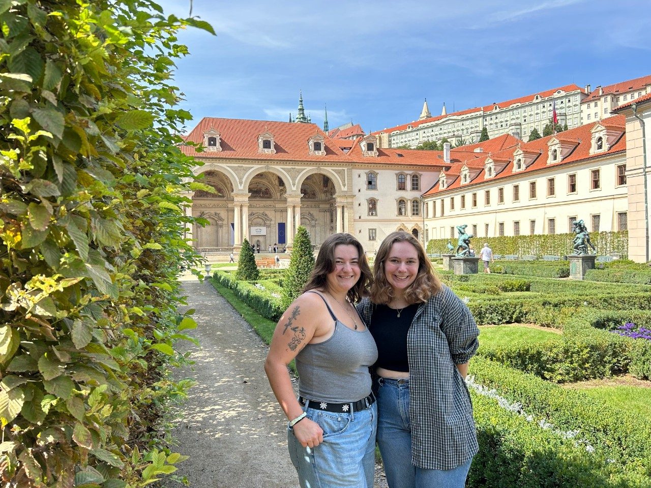 Two young people pose for a photo in the sunshine in Czechia