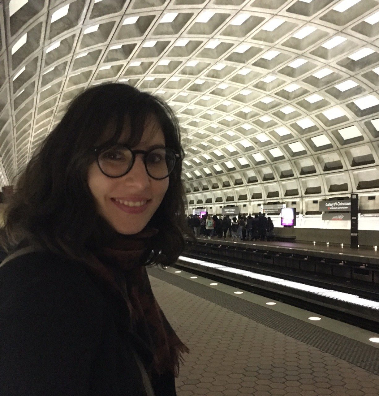 Duygu Ula smiling in a metro station