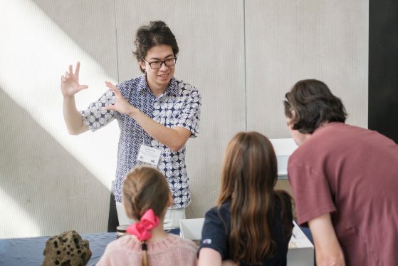 Yu Kai Tan, Ph.D. student shares his mollusk expertise with visitors.