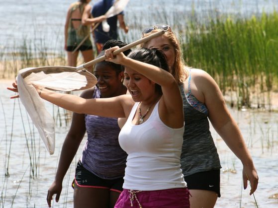 Students in water with net at UM Biological Station