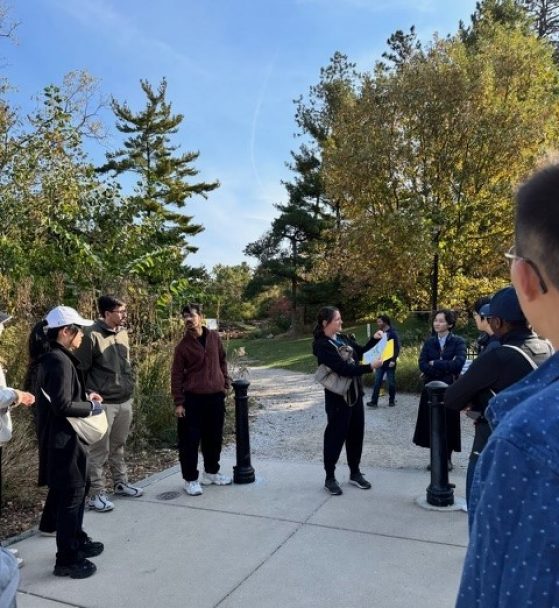 Trisha and students in the arb 