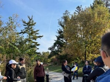 Trisha and students in the arb 