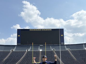 Shuhei standing in the football field 
