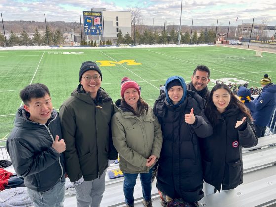 ELI Lecturer Trisha Dowling with students in her ELI 592 class at the Michigan Lacrosse Stadium, February 17, 2024