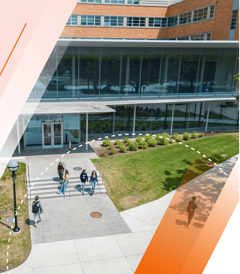 An aerial view of the entrance to the LSA Building atrium. Several students can be seen going up and down the steps.