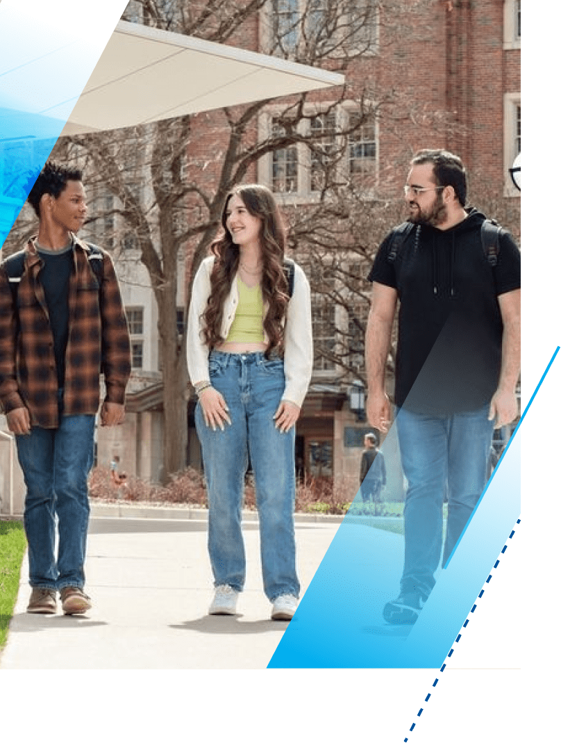 LSA Scholarship students Christian Hooper, Cora Vanfaasen, and Hassan Chammout walk together in conversation. They are on the sidewalk between the back doors of the Michigan Union and LSA Building. Each one carries backpacks on both shoulders.