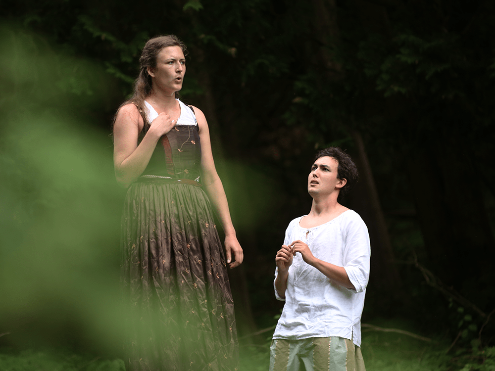Two actors performing in the Arb for a production of A Midsummer Night’s Dream.
