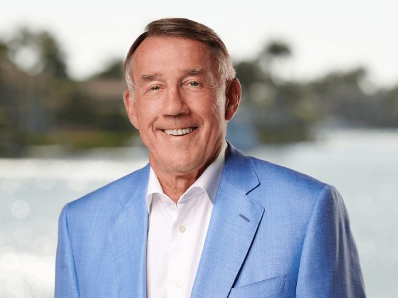 Leinweber Foundation Founder and President Larry Leinweber in a blue blazer and white dress shirt.