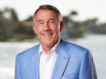 Leinweber Foundation Founder and President Larry Leinweber in a blue blazer and white dress shirt.