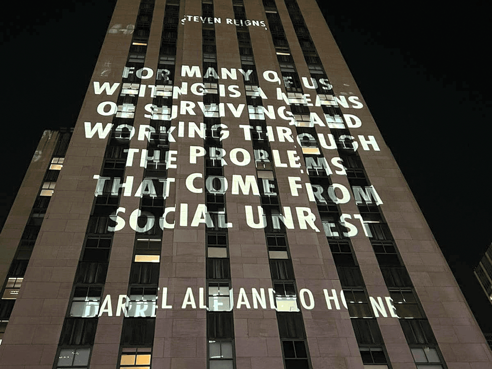 Darrel Alejandro Holnes’s original poetry is shining as projected light onto the Rockefeller Center building in New York City. 