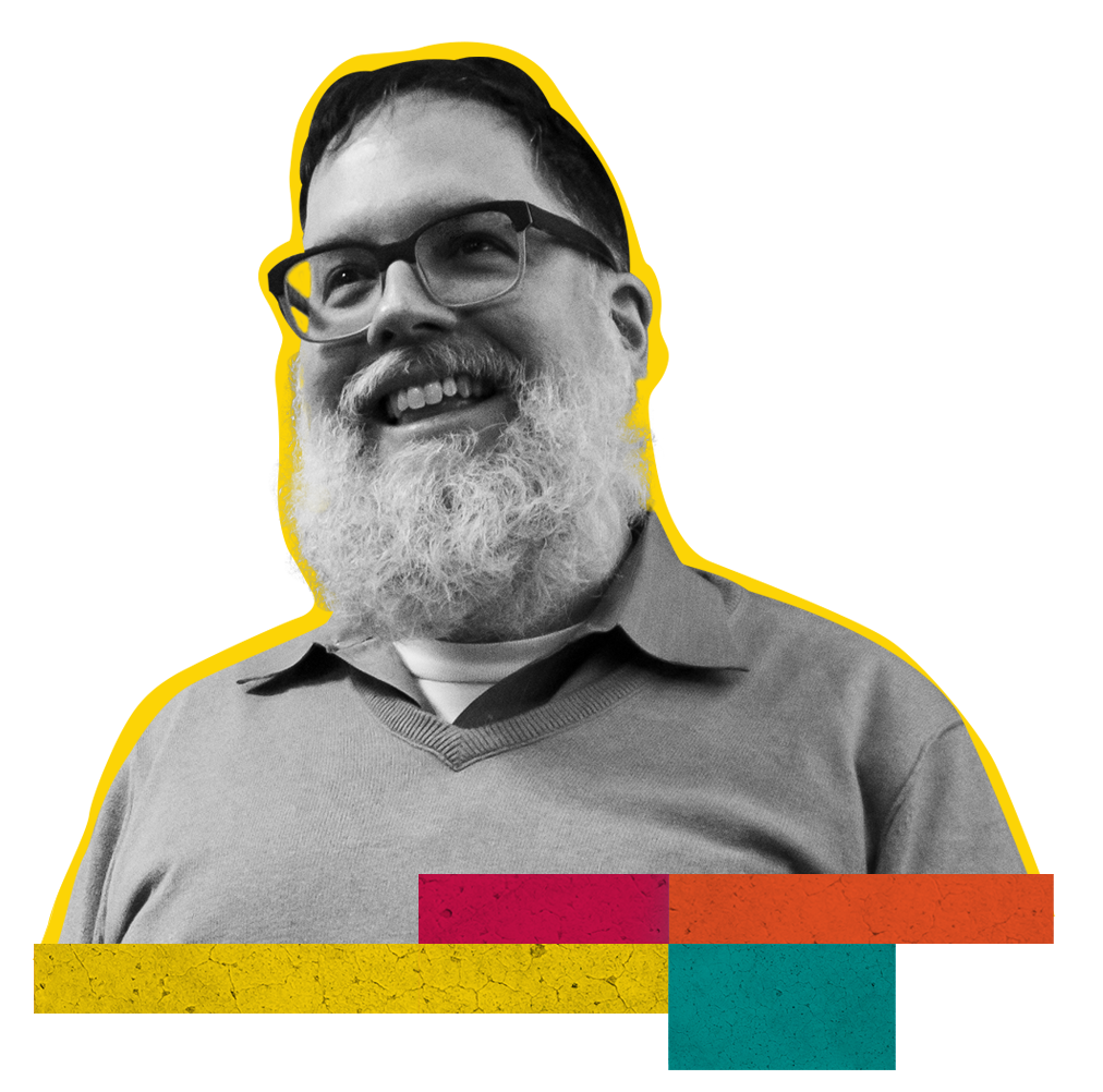 In front of a colorful, collaged backdrop are three images of Latina/o Studies core professor Larry La Fountain-Stokes. On the left, La Fountain-Stokes sits at a table, writing and facing a mirror. The image is in black and white. In the middle is a black and white portrait of a smiling Larry La Fountain-Stokes. On the right is a photograph in color of Larry La Fountain-Stokes as his drag persona Lola von Miramar. Lola wears a brilliant ruby-colored sweater, heaps of jewels, and shimmering blue polish on her fingernails. 