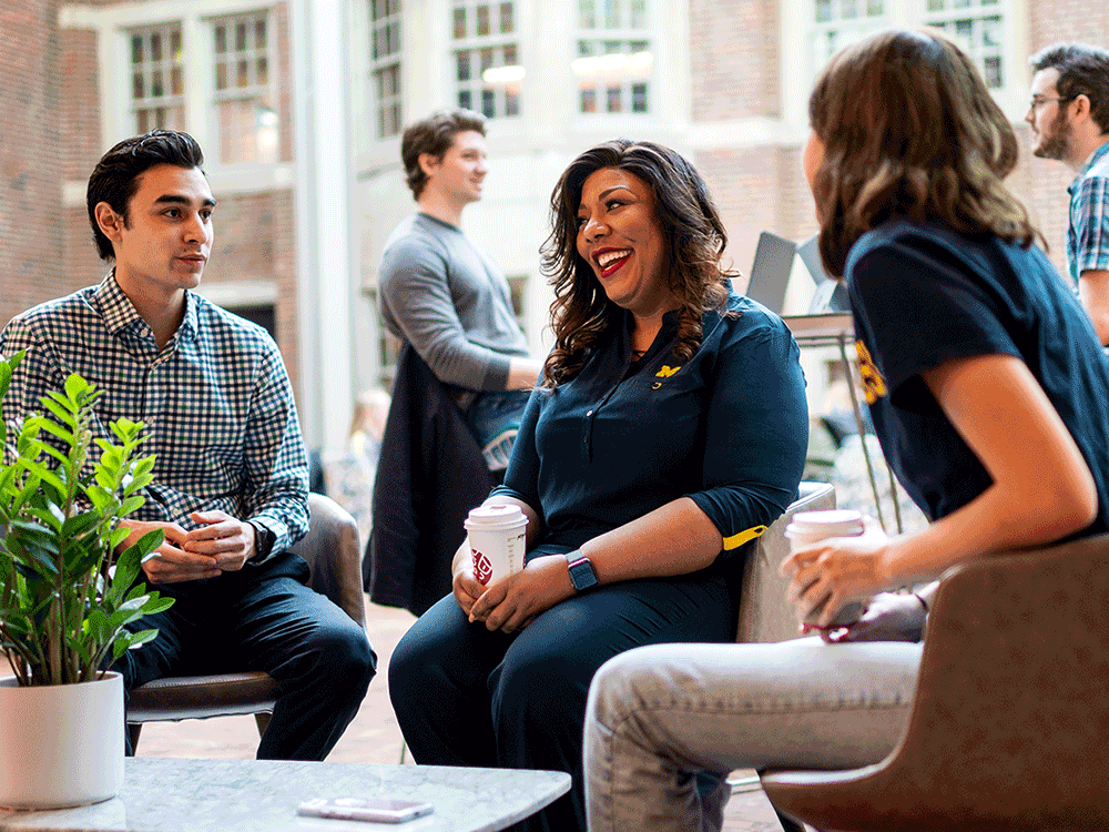 People drinking coffee and talking in the Michigan Union.