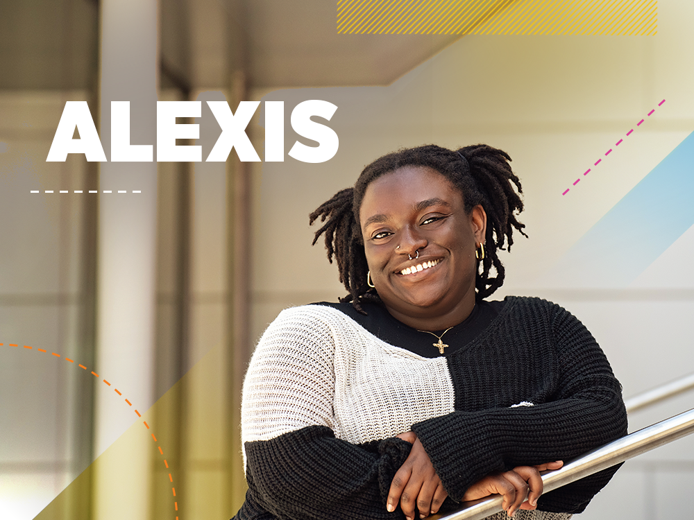 Alexis is leaning on a railing and smiling toward the camera. Text on the image reads "Alexis".