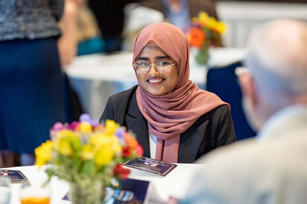 Sanzida Chowdhury chats with other attendees at her table at the Cain Memorial Award presentation in May 2024.