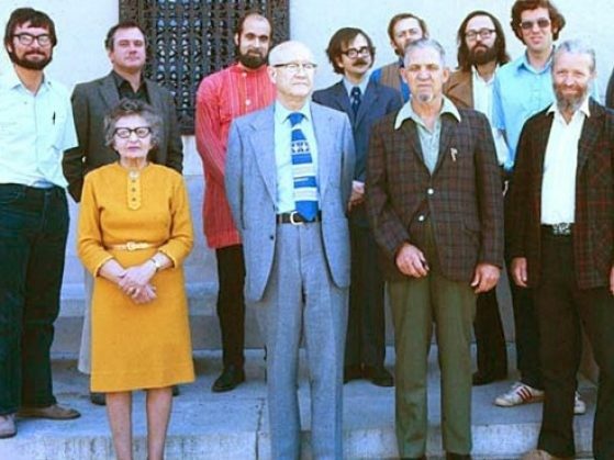 Ten UMMAA Curators and UMMA Director James B. Griffin standing in front of the Ruthven Museums Building in the late 1960s.