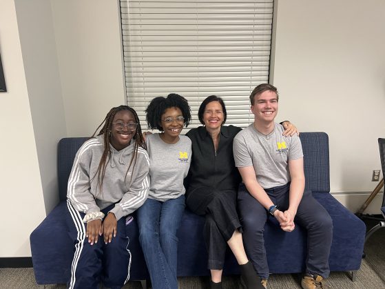 Students with guest on a couch