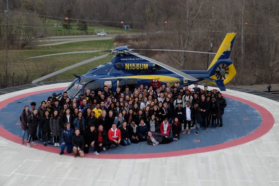 HSSP Students next to helicopter