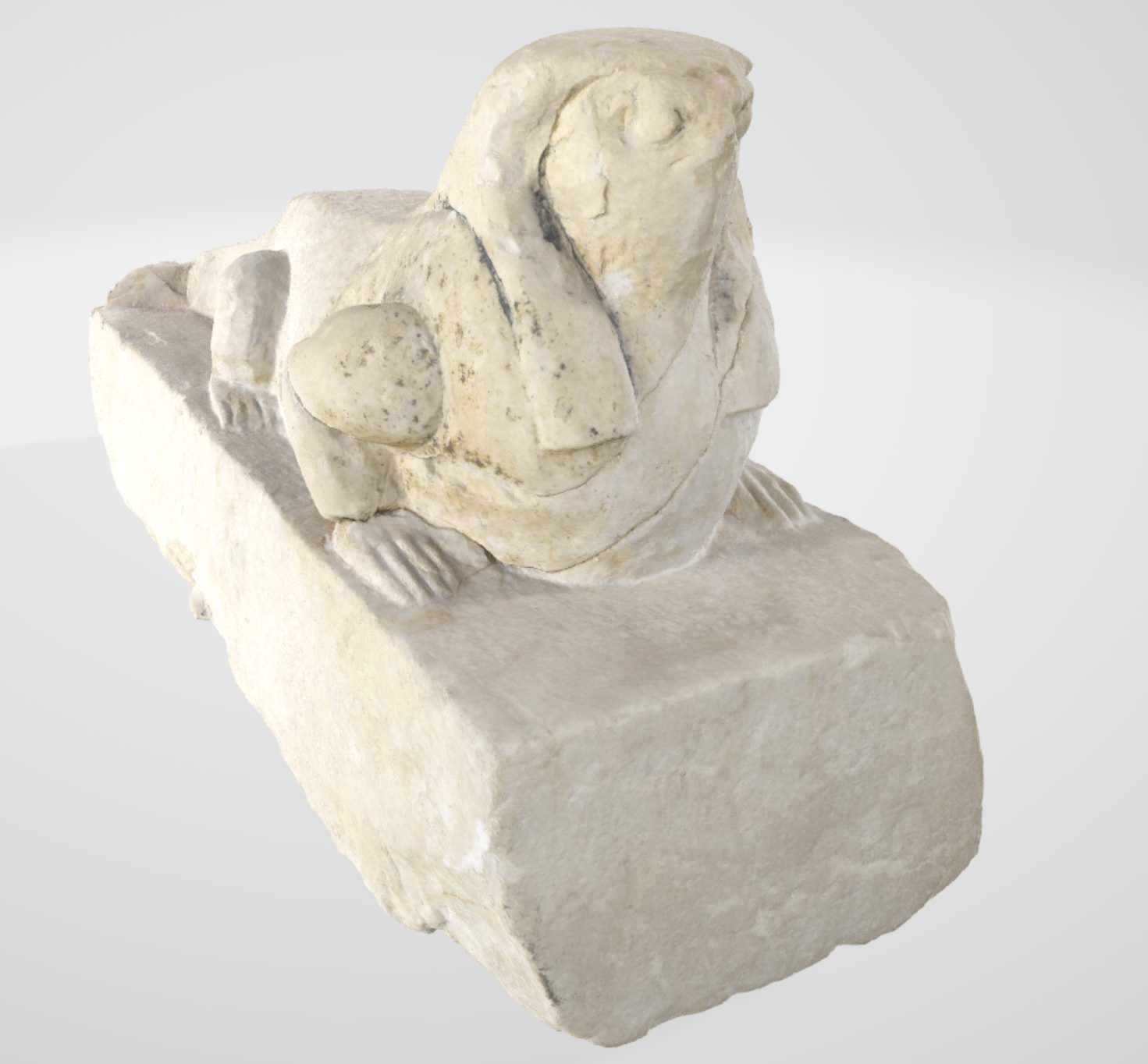 Limestone artifact with a rectangular base depicting the Egyptian god Soknopaios. He has the body of a crocodile, human hands, and the face of a falcon with long hair.