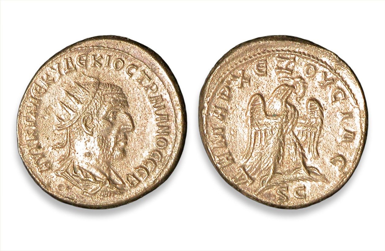 Obverse and reverse of a coin showing a man in profile and an eagle. Greek lettering lines the outer edge of each side.