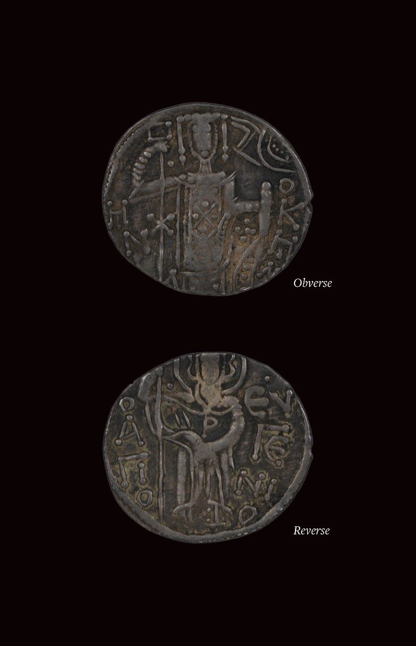 Collage of the front and back views of a silver coin with stylized etchings; the left has the bust of a man being crowned by the hand of God, and the right depicts a standing saint.