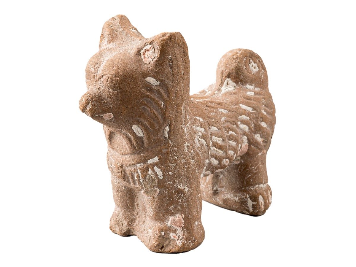 Ceramic dog figurine.