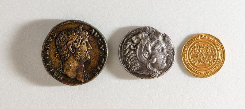 Three coins on a table.