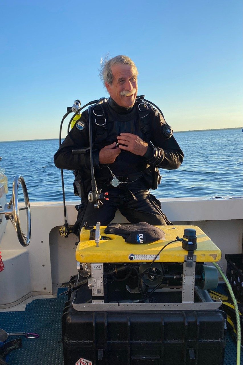 John O'Shea on a boat in diving gear.