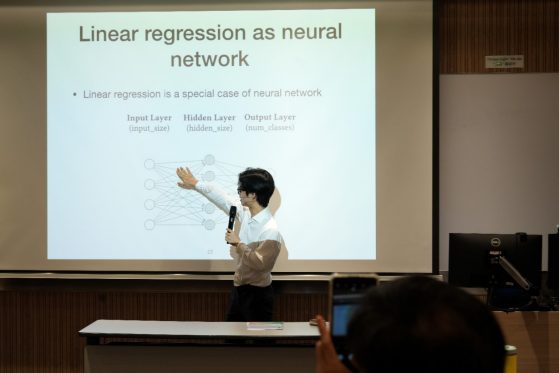 Huteng Dai Delivering Presentation