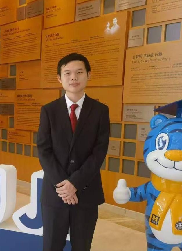 Image of student in a black suite