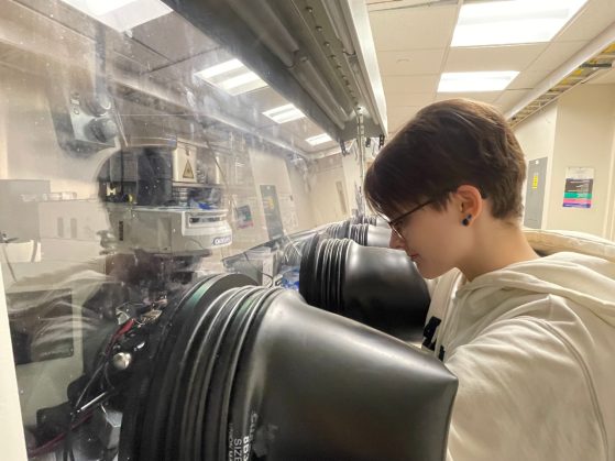 Irmina working on their research at a glovebox in Randall Lab.