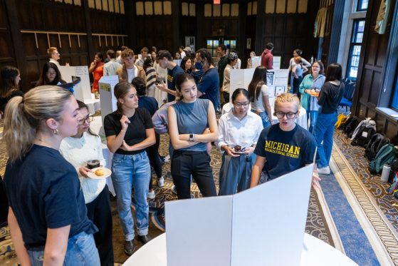 student group presenting a poster