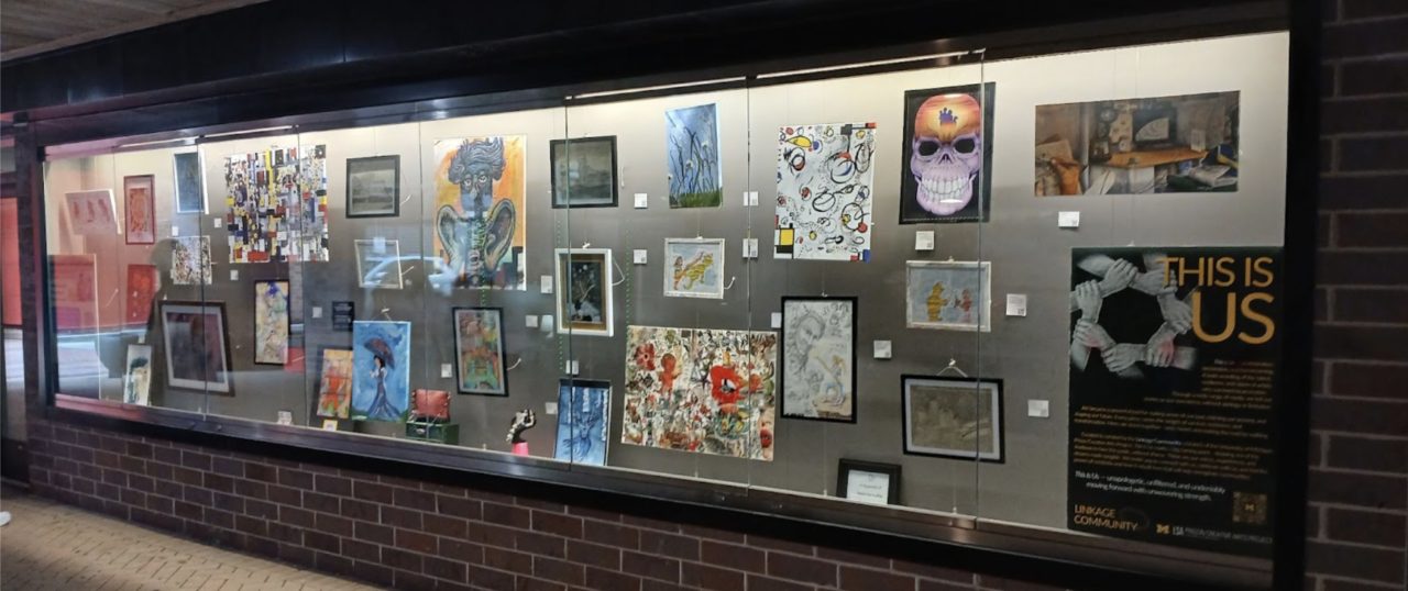 Display case of various artworks from exhibition