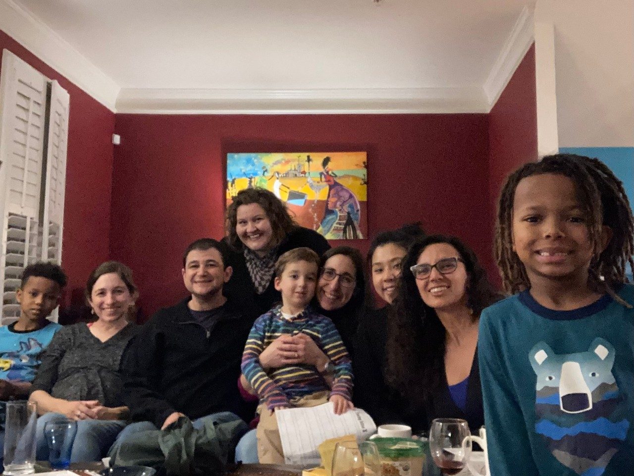 A group our past U-M students and their families smiling