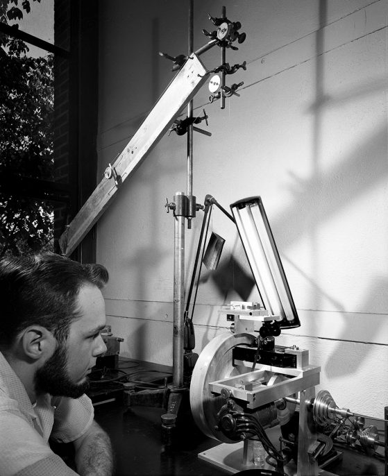 Larry Curtiss (above) and his faculty advisors pieced together a contraption that could do what no one thought was possible and ultimately led to modern fiber optics—at a cost of about $250 for their earliest machines.
