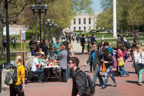 Students walking and gathering in the "Diag" at the University of Michigan