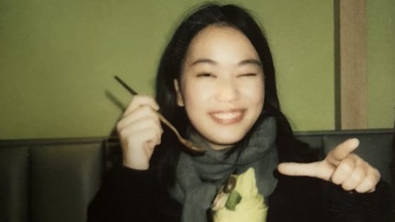 female student smiling at camera