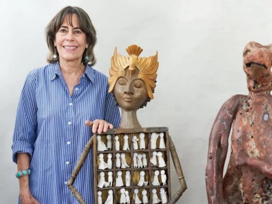 Ann Savageau with two sculptures from her latest exhibit