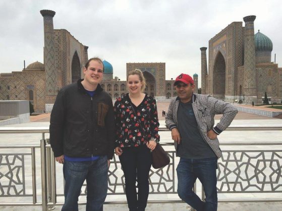 Chris Fort, left, with his sister, Sara Fort (AB ’12), and friend Shohruh Matjon in Samarqand-Registan
