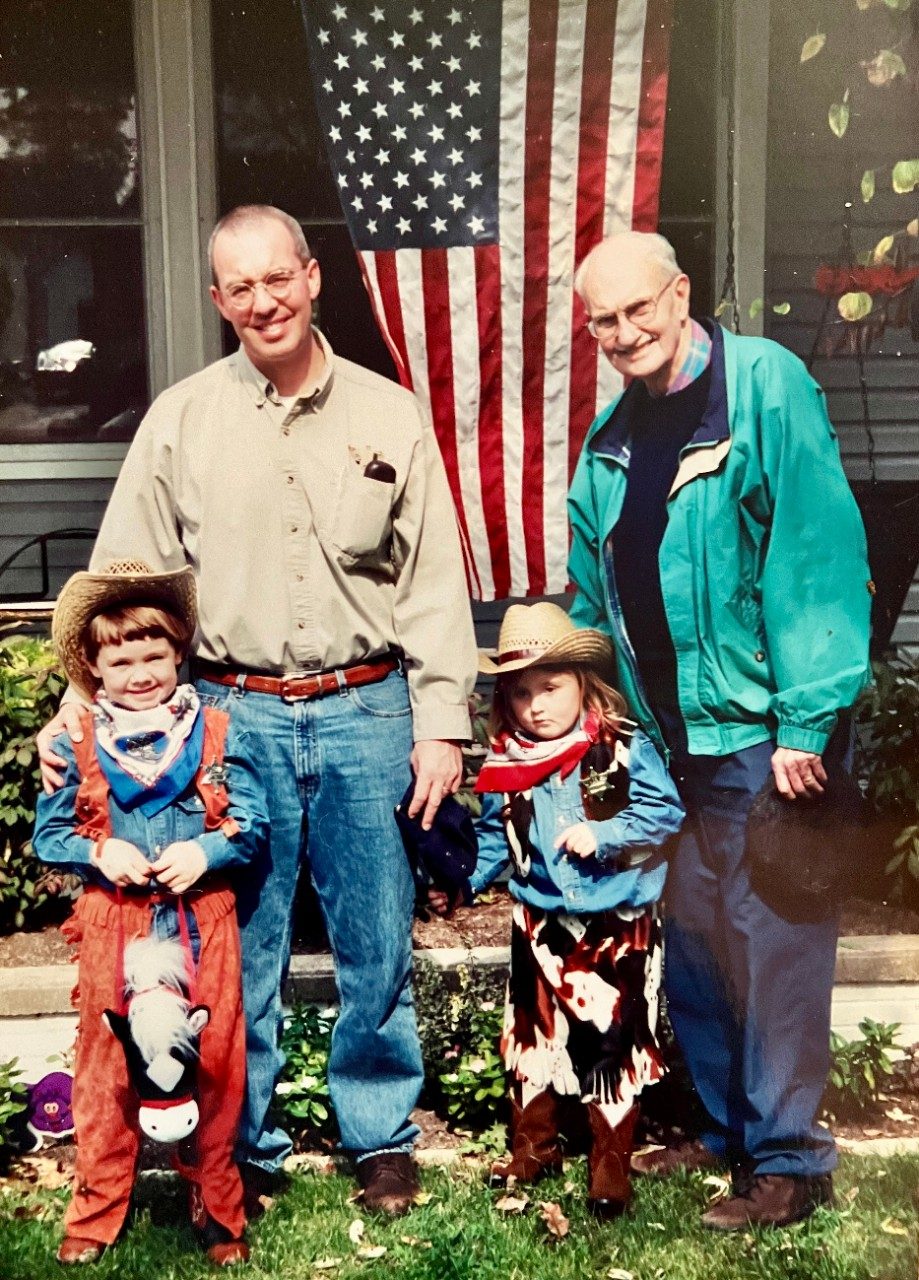 Family photo around Halloween because children are in costumes