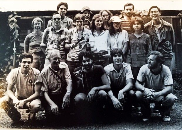About a dozen people posing for a group photo